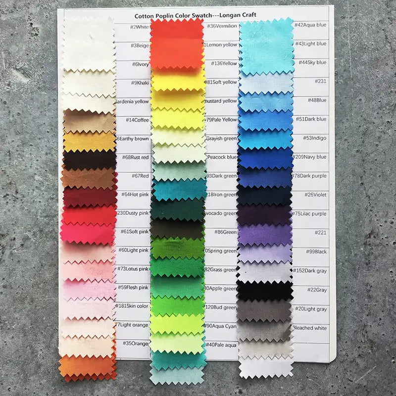 A sheet displays rows of colorful, lightweight Cotton Poplin swatches by Longan Craft, each cut with zigzag edges and arranged in columns over a printed list of matching color names and numbers.