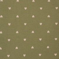 Pattern of small white hearts on a green fabric background