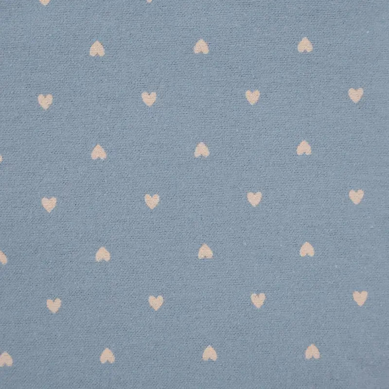 Pattern of small hearts on a blue background