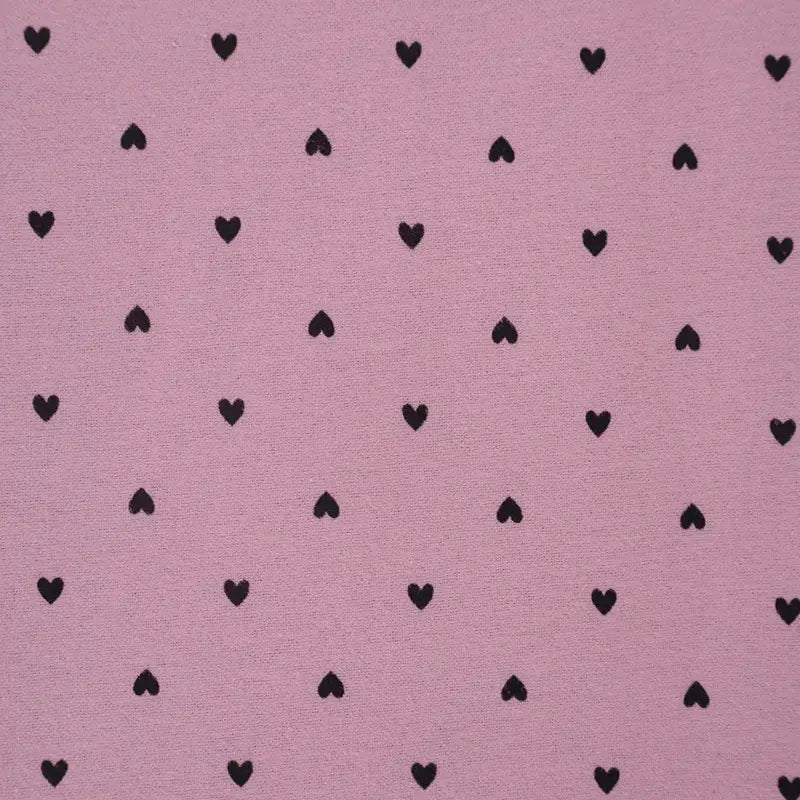 Pink fabric with black heart pattern