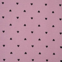 Pink fabric with black heart pattern