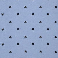 Pattern of black hearts on a light blue background