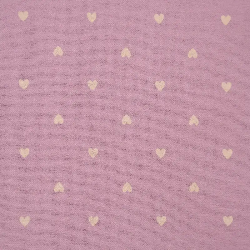 Pattern of small hearts on a textured pink background