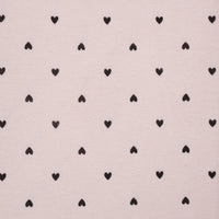 Pattern of black hearts on a light pink background