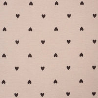 Pattern of small black hearts on a beige background