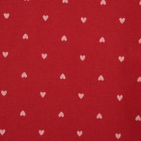 Red fabric with small white heart patterns