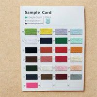 The Longan craft Color Swatch Bundle displays 25 numbered fabric samples—including corduroy, velvet, and double gauze—in assorted colors arranged in a grid, with company contact info at the top.