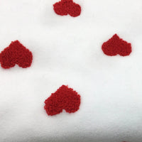 The Longon Craft Heart Polar Fleece Fabric By The Yard features a 3D red heart pattern on white polyester fleece—perfect for sewing and craft projects.