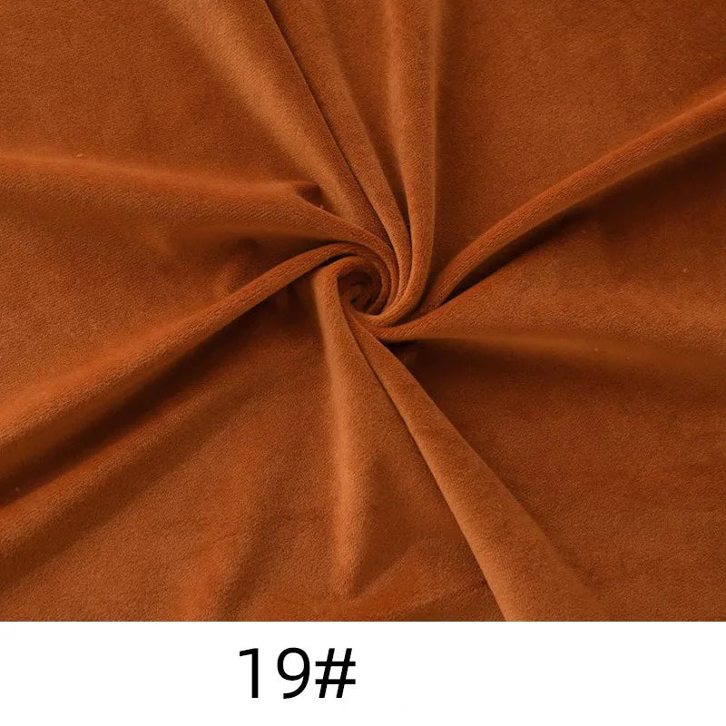 Longon Craft’s Solid Color Thick Cuddle Minky Fabric features brown, plush polyester twisted at the center, forming soft folds. “19#” is shown below on a white background. Perfect for plushies, crafts, and upholstery by the yard.