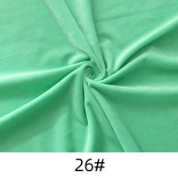 A piece of light green Longon Craft Minky Fabric By The Yard, solid thick cuddle plush polyester, twisted at the center and labeled "26#" at the bottom.