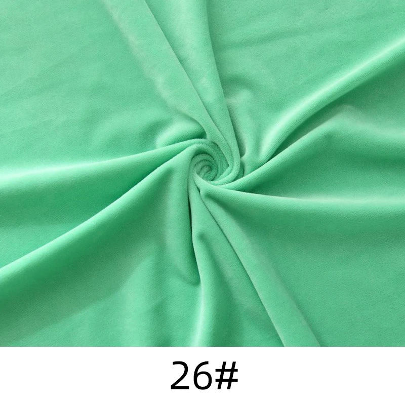 A piece of light green Longon Craft Minky Fabric By The Yard, solid thick cuddle plush polyester, twisted at the center and labeled "26#" at the bottom.