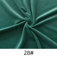 Longon Craft's Solid Color Thick Cuddle Minky Fabric by the yard features plush green polyester in a spiral pattern, labeled "28#", ideal for hypoallergenic baby blankets, soft dolls, plushies, crafts, or upholstery projects.