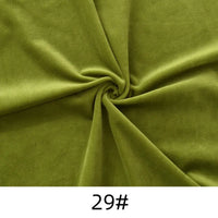 Olive green Longon Craft Minky Fabric By The Yard—solid color, thick cuddle plush polyester for sewing, upholstery, and crafts—is shown in a swirl pattern with the "29#" label at the bottom.