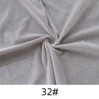 Longon Craft Solid Color Thick Cuddle Minky Fabric by the yard, shown in gray twisted into a spiral on a flat surface with "32#" labeled at the bottom, ideal for soft dolls, plushies, crafts, sewing, and upholstery.