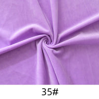 A piece of Longon Craft Minky Fabric By The Yard in light purple, featuring a swirl pattern, is shown. The soft, thick polyester plush material is ideal for dolls, plushies, crafts, and upholstery. "35#" is printed below the fabric.