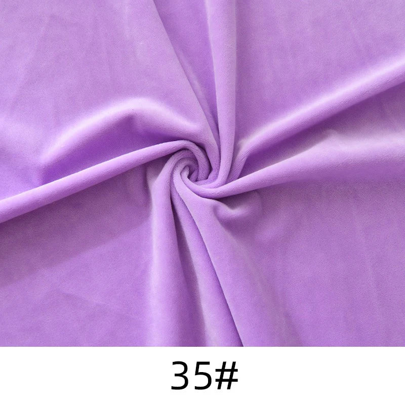 A piece of Longon Craft Minky Fabric By The Yard in light purple, featuring a swirl pattern, is shown. The soft, thick polyester plush material is ideal for dolls, plushies, crafts, and upholstery. "35#" is printed below the fabric.