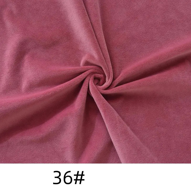 A close-up of Longon Craft Minky Fabric By The Yard in mauve pink (36#), showcasing its plush polyester texture swirled at the center, ideal for soft dolls, plushies, crafts, sewing, or upholstery.