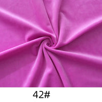 A piece of vibrant purple Solid Color Thick Cuddle Minky Fabric from Longon Craft is twisted at the center, with "42#" shown at the bottom.