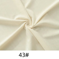 Cream-colored Minky Fabric by Longon Craft, shown swirled and labeled "43#", is a thick, soft plush material ideal for dolls, plushies, crafts, and upholstery projects.