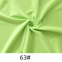 A light green Longon Craft Minky Fabric By The Yard is twisted in the center, forming folds and a spiral pattern. The number "63#" appears at the bottom, showing this soft thick cuddle minky fabric for plushies, crafts, and upholstery.