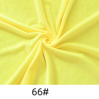 A spiral of yellow Minky Fabric By The Yard from Longon Craft is shown, with "66#" at the bottom. This solid color thick cuddle minky is perfect for plushies, crafts, or upholstery.