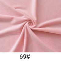 Light pink Longon Craft Minky Fabric By The Yard (code "69#") in thick, soft polyester microfiber is swirled to display texture and folds—ideal for plushies, crafts, and upholstery.