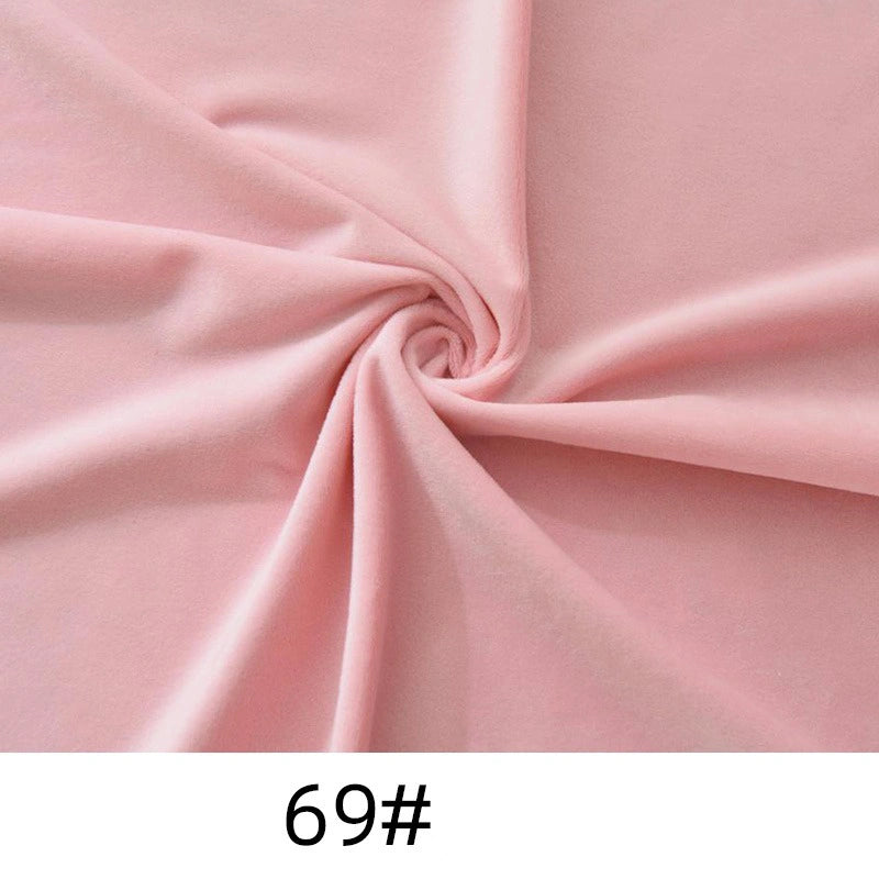 Light pink Longon Craft Minky Fabric By The Yard (code "69#") in thick, soft polyester microfiber is swirled to display texture and folds—ideal for plushies, crafts, and upholstery.