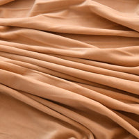 Longon Craft’s Solid Color Thick Cuddle Minky Fabric by the yard features ultra-soft plush polyester and is ideal for crafting hypoallergenic baby blankets, soft dolls, plushies, and more.