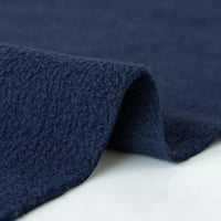 A close-up of Longon Craft’s Plain Polar Fleece Fabric By The Yard—thick, dark blue, anti-pill polyester with a soft, textured surface—folded on a white background. Ideal for stretch sewing projects.