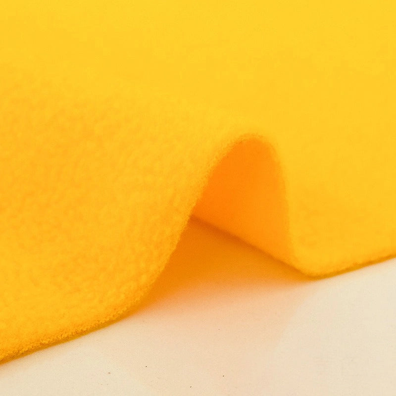 A close-up of Longon Craft's Plain Polar Fleece Fabric by the Yard shows its thick, anti-pill polyester texture with soft folds—ideal for thermal blankets or outdoor jackets. Perfect stretch sewing material for cozy, durable projects.