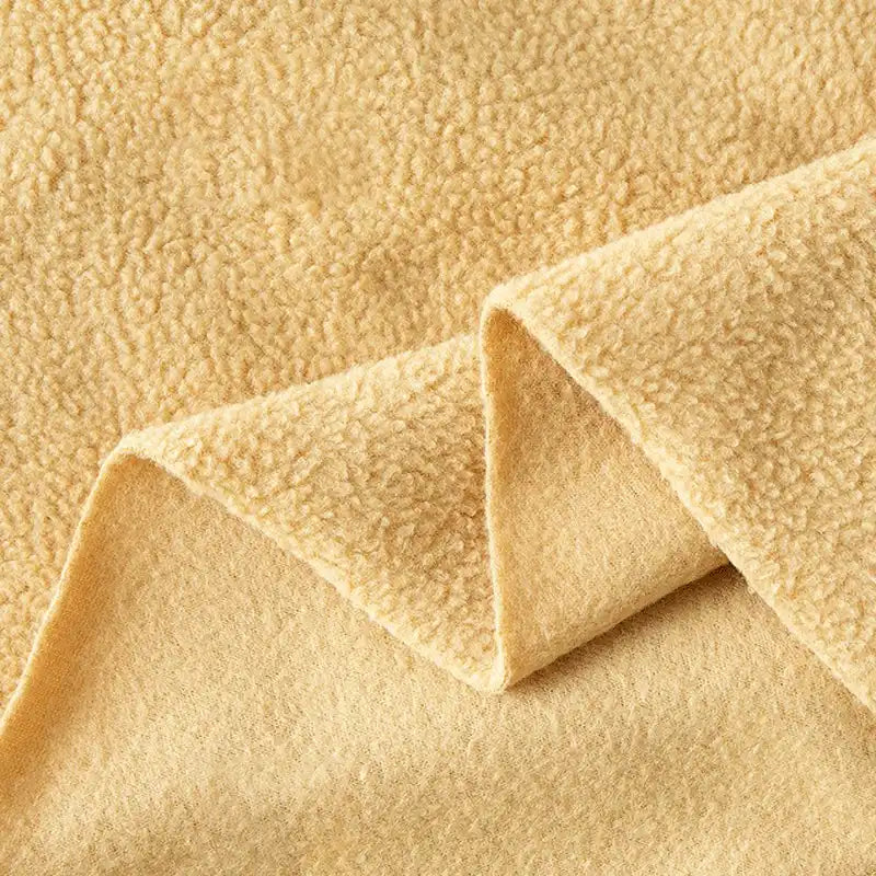 Close-up of Longon Craft’s Plain Polar Fleece Fabric by the yard, a thick, anti-pill polyester material with a soft, textured surface and smooth underside—ideal for cozy jackets, blankets, and stretch sewing projects.