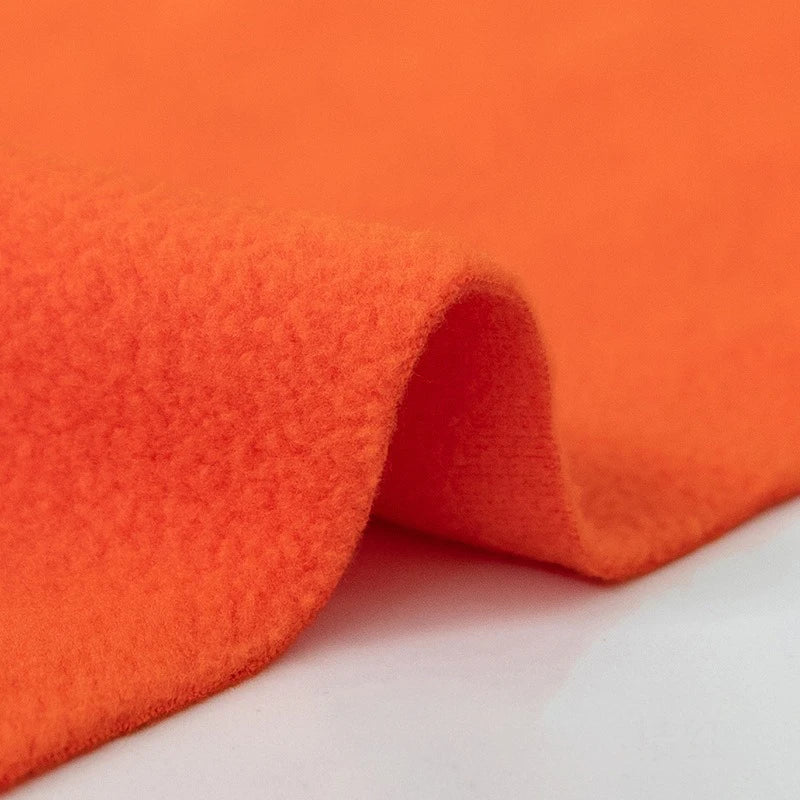 A close-up of Longon Craft’s Plain Polar Fleece Fabric by the Yard showcases its thick, anti-pill polyester with a soft, fuzzy texture—ideal for jackets, thermal blankets, or stretch sewing projects.