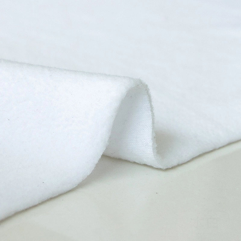 A close-up of Longon Craft Plain Polar Fleece Fabric by the yard shows its smooth, thick, anti-pill polyester surface and slight stretch, with a lifted edge highlighting its texture and quality against a neutral background.