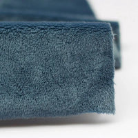 Close-up of the edge of Longon Craft’s dark blue Plush Minky Fabric by the Yard—5mm soft polyester minky material with a fuzzy texture, ideal for cozy baby blankets, plushies, sewing, and crafts.