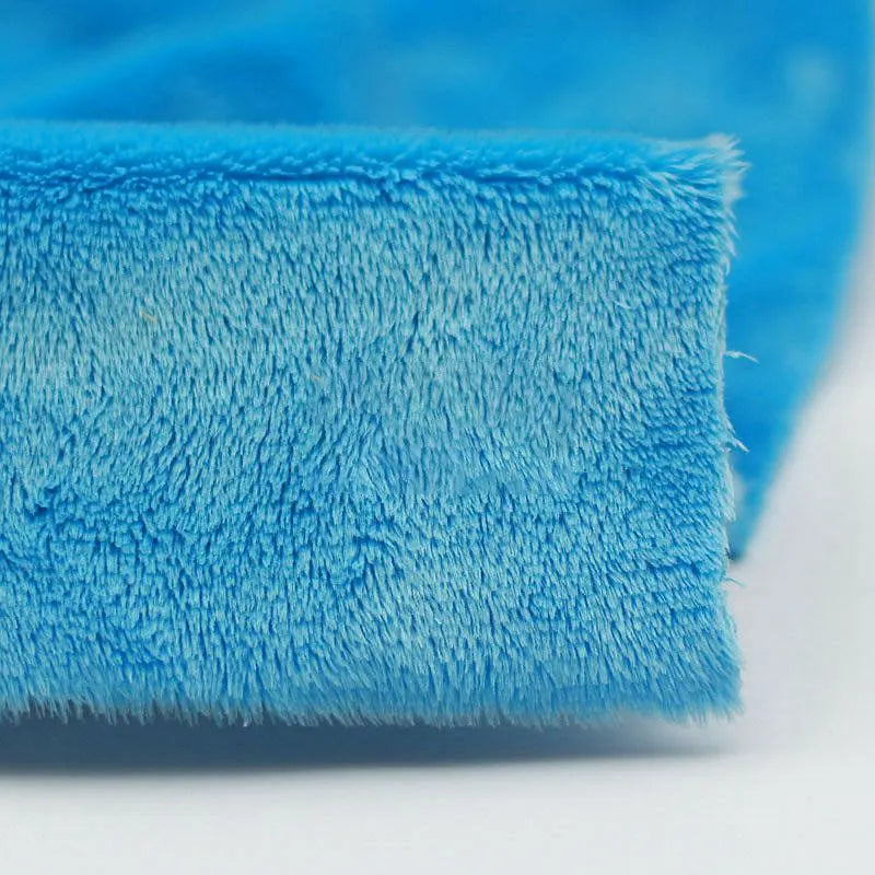 Close-up of Longon Craft Plush Minky Fabric by the Yard in bright blue, featuring 5mm soft polyester for a cozy, fuzzy texture—ideal solid color material for plushies, baby blankets, sewing, and crafts.
