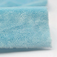Close-up of Longon Craft Plush Minky Fabric by the yard in light blue, featuring ultra-soft 5mm polyester material with a plush texture similar to fabric used in plushies and baby blankets.