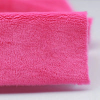 Close-up of a folded, bright pink Plush Minky Fabric by Longon Craft, featuring ultra-soft 5mm polyester minky material—ideal for plushies, sewing, and crafts.