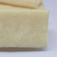 Close-up of Longon Craft Plush Minky Fabric by the Yard in light yellow, a 5mm soft polyester minky perfect for plushies, sewing, and crafts—ideal as cozy baby blanket material.