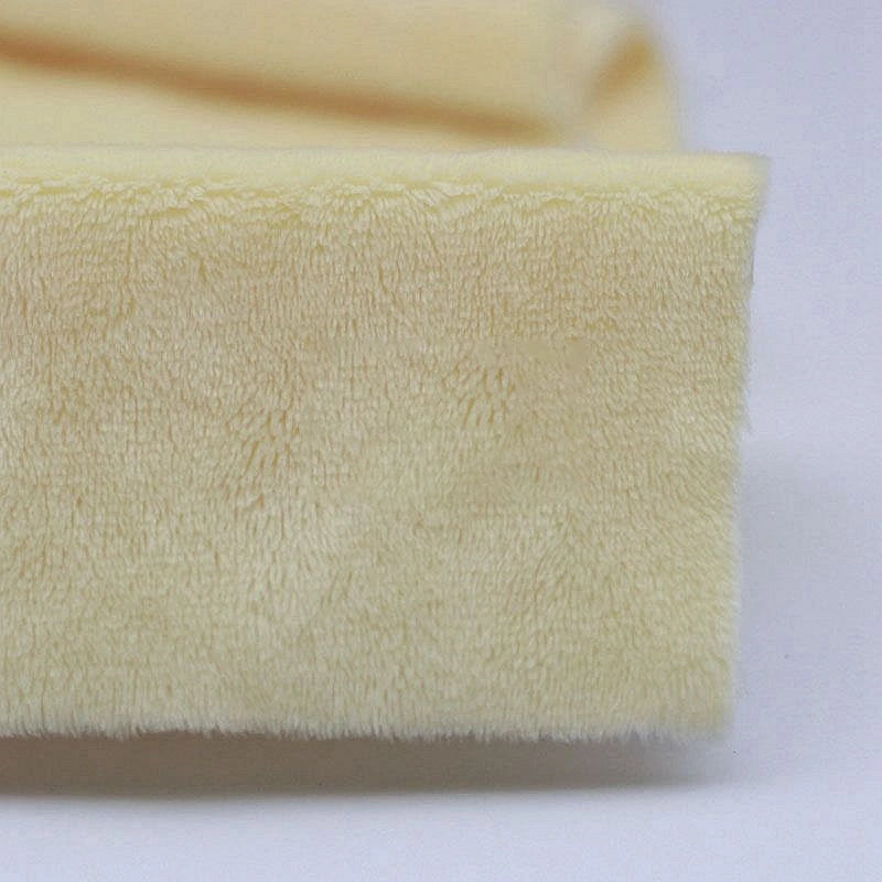 Close-up of Longon Craft Plush Minky Fabric by the Yard in light yellow, a 5mm soft polyester minky perfect for plushies, sewing, and crafts—ideal as cozy baby blanket material.