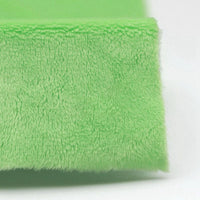 Close-up of Longon Craft Plush Minky Fabric by the yard—5mm soft polyester in solid green, ideal for plushies, sewing projects, and cozy baby blankets.