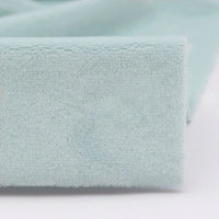 Close-up of Longon Craft Plush Minky Fabric by the Yard in light blue, highlighting its soft 5mm polyester texture—ideal for plushies and sewing crafts, similar to fabric used in baby blankets.