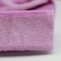 Close-up of Plush Minky Fabric By The Yard from Longon Craft—a soft, 5mm polyester minky in pink, ideal for plushies or baby blankets. Perfect solid color fabric for sewing and crafts.