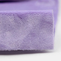 Close-up of Longon Craft’s Plush Minky Fabric By The Yard—5mm soft polyester minky in a solid purple color, featuring a slightly fuzzy texture and folded edge, perfect for plushies and sewing crafts.