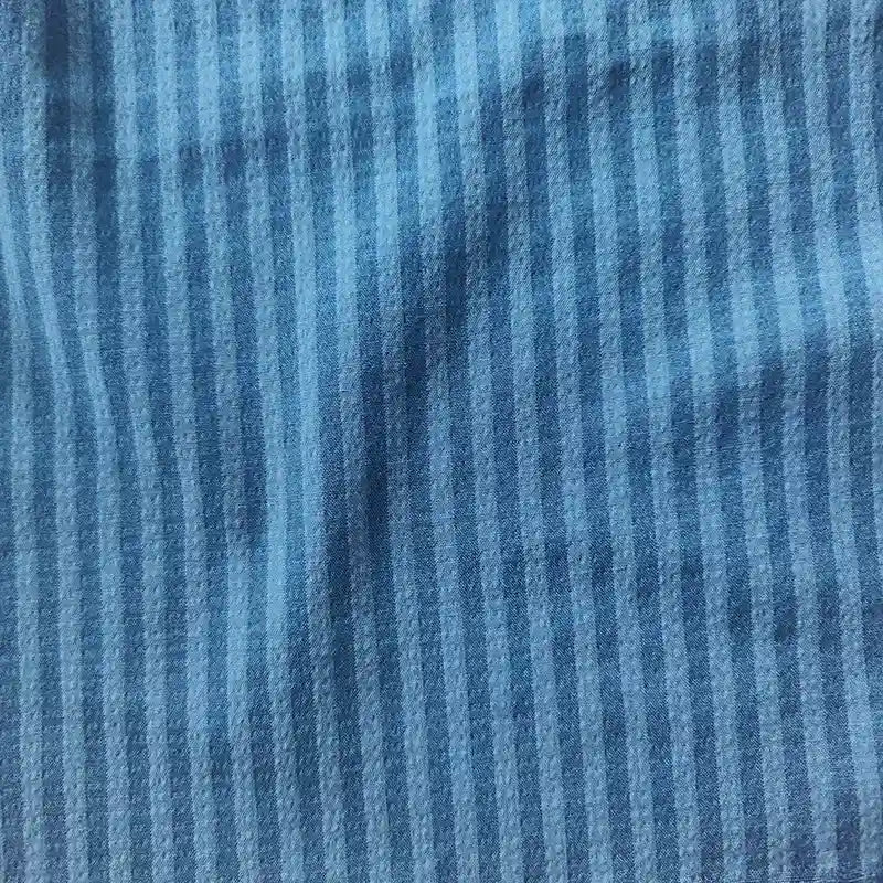 Close-up of blue fabric with vertical stripes