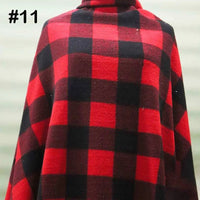 A person wearing a poncho made from Longon Craft Printed Polar Fleece Fabric By The Yard in an ethnic leopard pattern; the number “#11” is displayed in black at the top left.