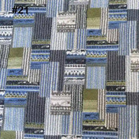 Longon Craft's Printed Polar Fleece Fabric By The Yard features an ethnic leopard pattern in blue, green, gray, and beige, ideal for DIY crafts and sewing. Polyester material resembles classic patterned polar fleece styles.