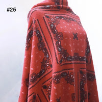 A person is draped in Longon Craft's Printed Polar Fleece Fabric By The Yard, featuring an ethnic leopard pattern. "#25" appears in the top left corner on a plain light background.