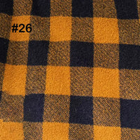 A Longon Craft Printed Polar Fleece Fabric features an ethnic leopard pattern in mustard yellow and dark navy blue, labeled #26 in black text at the top left. Perfect for DIY crafts and sewing projects.
