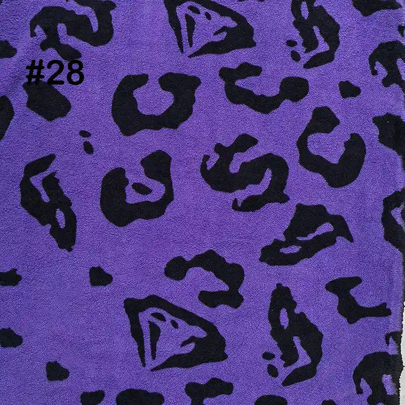 Longon Craft’s Printed Polar Fleece Fabric by the yard is polyester with an ethnic leopard print pattern, perfect for DIY crafts and sewing. The number #28 appears in black text in the upper left corner.