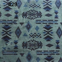 Blue and black geometric and diamond patterns on a textured green background, featured on Longon Craft’s Printed Polar Fleece Fabric By The Yard, Polyester Ethnic Leopard Patterned material for DIY craft sewing. Labeled 29 in the top left corner.